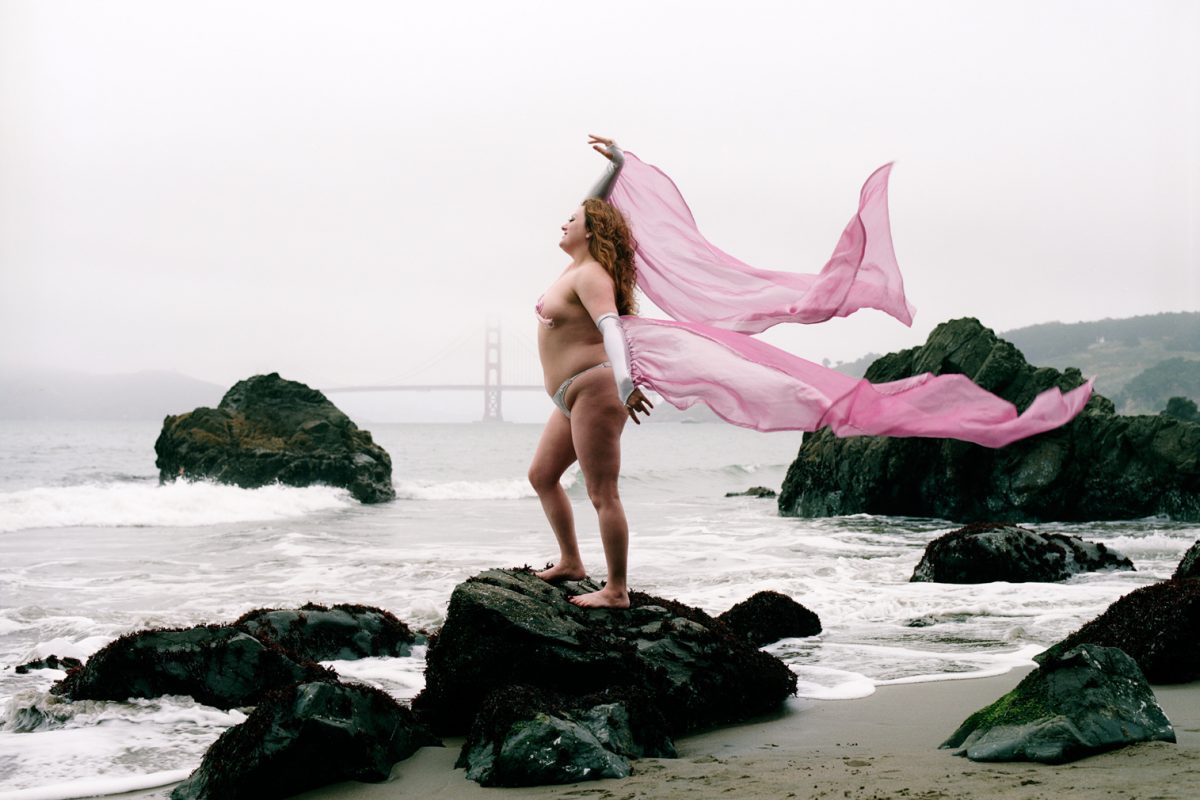 Lady Monster photographed at China Basin beach in San Francisco was titled Queen of the Fire Tassels by burlesque sensation, Satan's Angel.