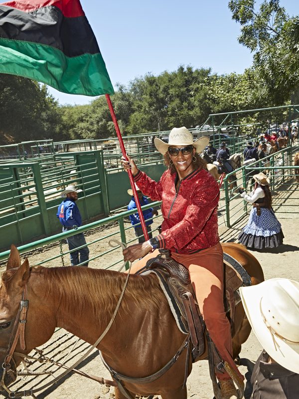Carolyn Carter tours the African American flag at the BPIR Grand Entry. Carter has been active with BPIR since it was found in 1984, having not missed one of the association’s rodeos in more than 38 years. 

Bill Pickett Invitational Rodeo in Oakland, CA - July 10th, 2022.